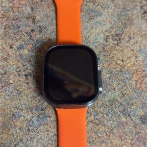 Apple Smartwatch with Black Face and Orange Band